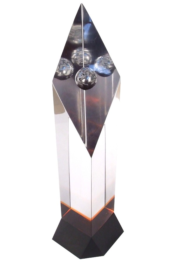 silver globe embedded in custom acrylic shape with translucent red accent and black base